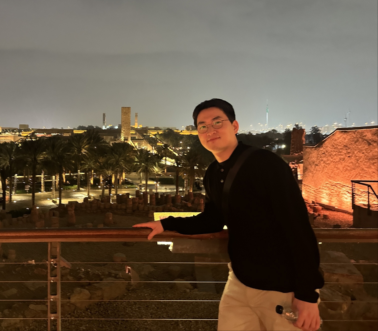 Jongchan Choi standing at a rooftop overlooking Diriyah, Riyadh
